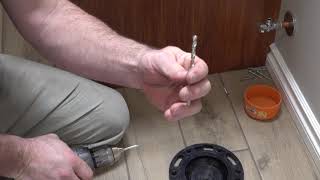 How To Install A Toilet Flange On A Tile Floor [upl. by Nylanej]