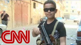 Child fighter with AK 47 on Syria border [upl. by Epolulot643]