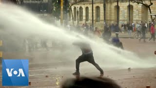 Colombian Police Use Water Cannons Tear Gas Against Protesters [upl. by Enotna]