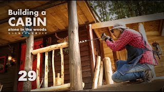 Building a cabin with improvisations 29 quotPorch railing and Half log benchquot [upl. by Bordie]