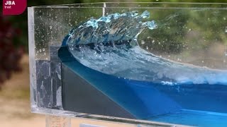 Wave tank demonstration showing the impact of coastal defences on flood risk [upl. by Kcirdnek413]