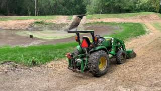 Dredging a farm pond with compact tractors Part 2 [upl. by Nakhsa]