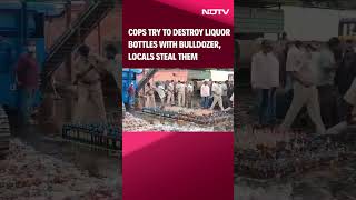 Andhra Pradesh News  Cops Try To Destroy Liquor Bottles With Bulldozer Locals Steal Them [upl. by Marteena]