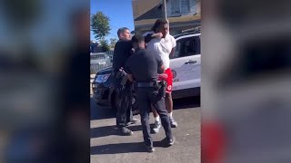 LAPD officer punches handcuffed man during arrest in Watts [upl. by Terhune85]