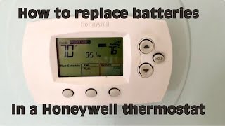 How to replace the AA batteries in a Honeywell Thermostat [upl. by Boff]