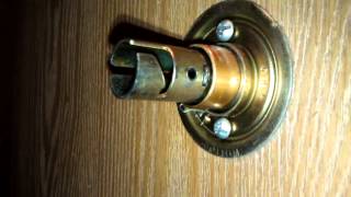 How to tighten a door knob [upl. by Ocirrej]