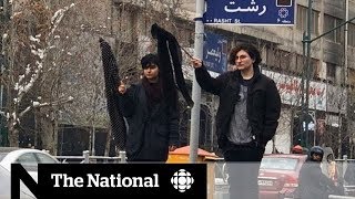 Women protest hijab laws in Iran [upl. by Koal]