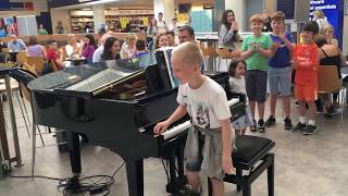 Amazing airport pianist Harrison aged 11 plays Ludovico Einaudi cover Nuvole Bianche [upl. by Gran]