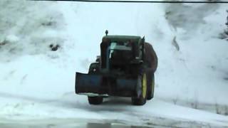 tractor slides backwards trying to get up a snow covered hill [upl. by Alta]