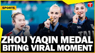 Zhou Yaqin Chinese gymnast adorable metalbiting moment goes viral at Paris Olympics 2024 [upl. by Halley366]