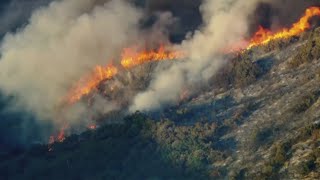 Firefighters battle dozens of wildfires fueled by dangerous heat wave and high winds [upl. by Ahsenad]