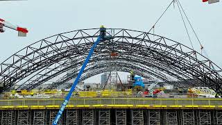 Installation process of the Rail Baltica Riga Central Station roof’s fourth arch [upl. by Zzahc586]