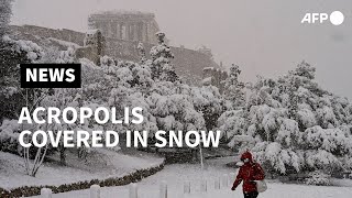 Snow covers Athens Acropolis  AFP [upl. by Ailem]