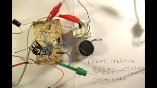 Light sensitive 12 V power relay made with a discarded solar cell  a Schmitt trigg schem amp demo [upl. by Hernando]