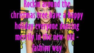 Miley Cyrus Rockin around the christmas tree lyricsFULL [upl. by Ahtekal]