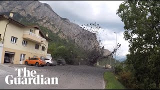 Mudslide sweeps into Swiss village [upl. by Aihsei]