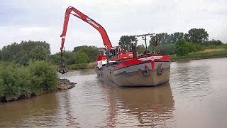 Baggerschiff quotNeptunusquot mit Sennebogen 835  Dredger quotNeptunusquot with excavator Sennebogen 835 [upl. by Harmaning]