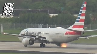 Wheel on American Airlines Boeing plane bursts into flames just ahead of takeoff [upl. by Nehr]