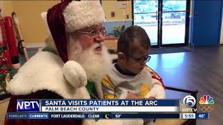 Santa Claus visits clients at the Arc [upl. by Aicilanna]