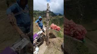 Transporting farm produce from a valley using pulley modified motorbike [upl. by Akenor]