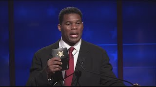 Herschel Walker apparently pulls out badge during debate [upl. by Jacinthe789]