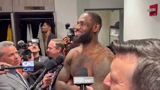 LeBron James watches Bronnys USC game while giving postgame interview 🎥  NBA on ESPN [upl. by Evars]