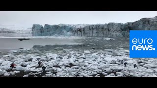 Watch Tourists flee large wave after Icelandic glacier collapse [upl. by Thompson]