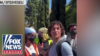 WATCH Protesters block Jewish UCLA student from class [upl. by Groos]