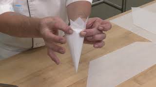 How to make a cornet pastry bag out of a sheet of parchment paper for ProStart students [upl. by Nylinnej]