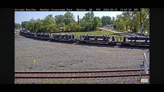 CSX steel bulkhead train with CSX pride in service unit at Deshler Railcam [upl. by Eckmann]