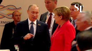 Angela Merkel gives Vladimir Putin epic eye roll [upl. by Sarene]