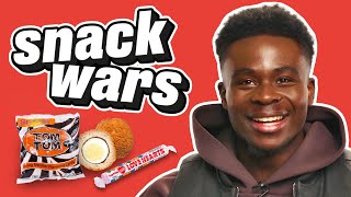 Arsenal Star Bukayo Saka Rates British And Nigerian Food  Snack Wars [upl. by Ardnahc]