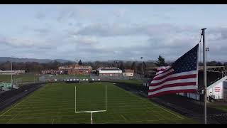 Shot of a US Flag Waving on Top of a Football Field [upl. by Nowahs]