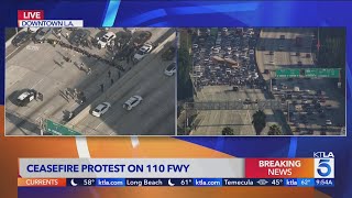 Breaking News Antiwar protesters block freeway in downtown LA [upl. by Ahsieym46]