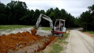 Trenching with the Mini Excavator [upl. by Annovaj]