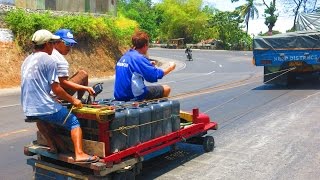 Filipino Giant Wooden Go Karts Behind Cars  Transporting Water With Kariton [upl. by Kieffer]