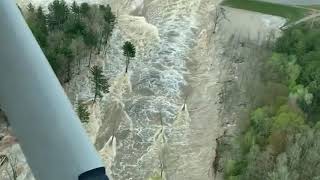 Pilot captures rushing water flowing through failed Edenville Dam [upl. by Ynar808]