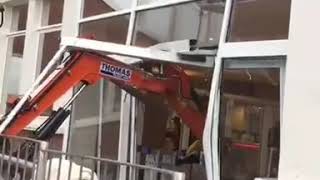 DIGGER SMASHES UP HOTEL LOBBY TRAVELODGE LIVERPOOL  Builder didnt get paid so went nuts [upl. by Tigram2]