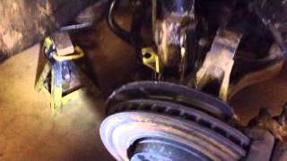 Volvo V70XC Front Strut Removal  Broken Coil Spring [upl. by Einallem834]