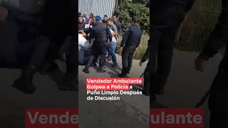 Vendedor ambulante golpea a policía a puño limpio después de discusión  N Shorts [upl. by Odnomra830]