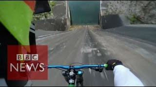 Biker films insane 60m bike dam drop in Slovenia  BBC News [upl. by Sualokcin467]