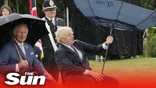 Boris Johnson struggles with umbrella at police memorial [upl. by Ginevra]