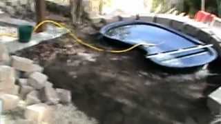 How to Install a Raised Koi Pond with Water Course Retaining Wall and Rock Path Part 1 [upl. by Llennahc]