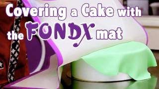 How to Cover a Cake in Rolled Fondant  Cake Tutorials [upl. by Letnuahc]