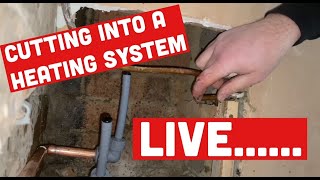 CUTTING INTO LIVE CENTRAL HEATING PIPES to fit RADIATOR without draining the system Plumbing trick [upl. by Dekeles]