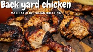 Grilled chicken marinated in Italian salad dressing  backyard style in a Weber kettle grill [upl. by Neerod935]