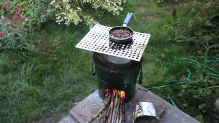 Cooking on a rocket stove Afab World Charity research kitchen [upl. by Emmerie]