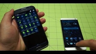 Galaxy S 4 vs HTC One  Pocketnow [upl. by Mollie323]