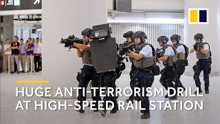 Hong Kong police hold large antiterrorism drill at highspeed rail link to mainland China [upl. by Adnawyek]