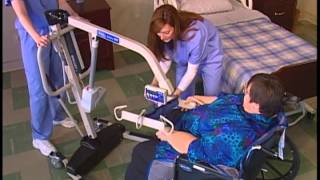 Transferring a patient from wheelchair to bed with a Reliant 600 and full body sling [upl. by Queri]